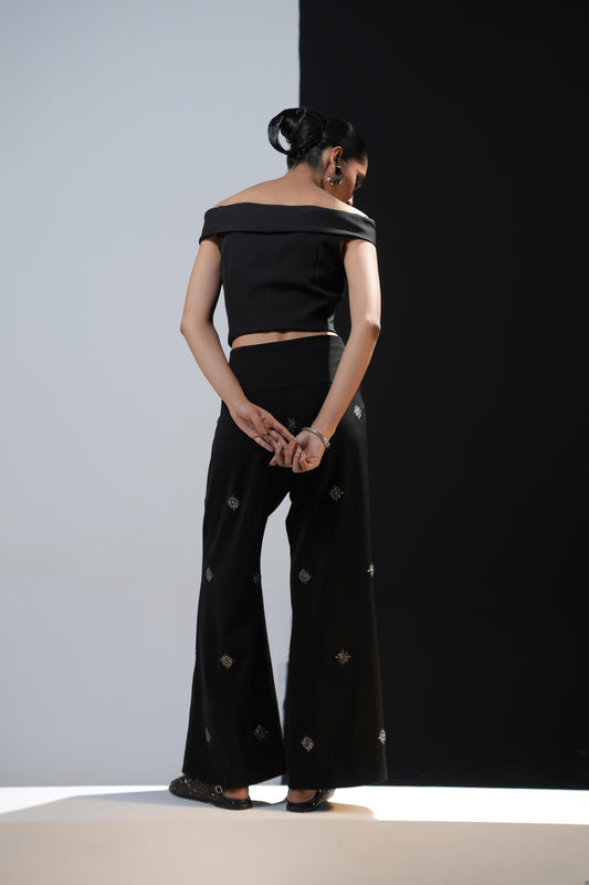 Black boot cut trousers with swaroski embelishments