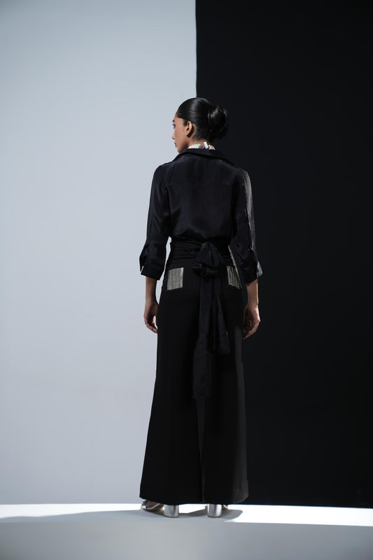 Black bootcut trousers with swaroski detailed pockets
