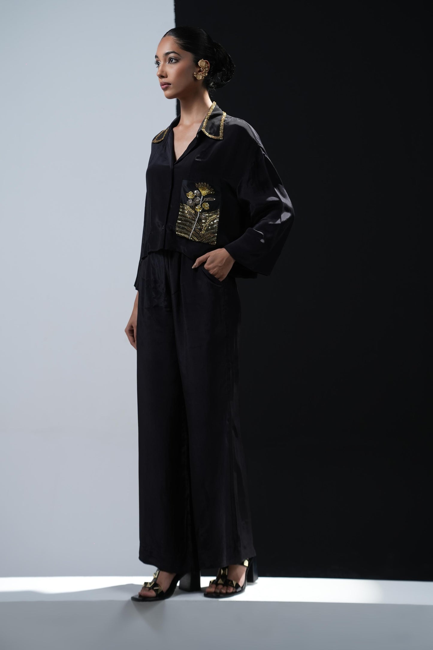 Crepe coord set with short flowing shirt and tonal gold zardosi detailing paired with black trousers