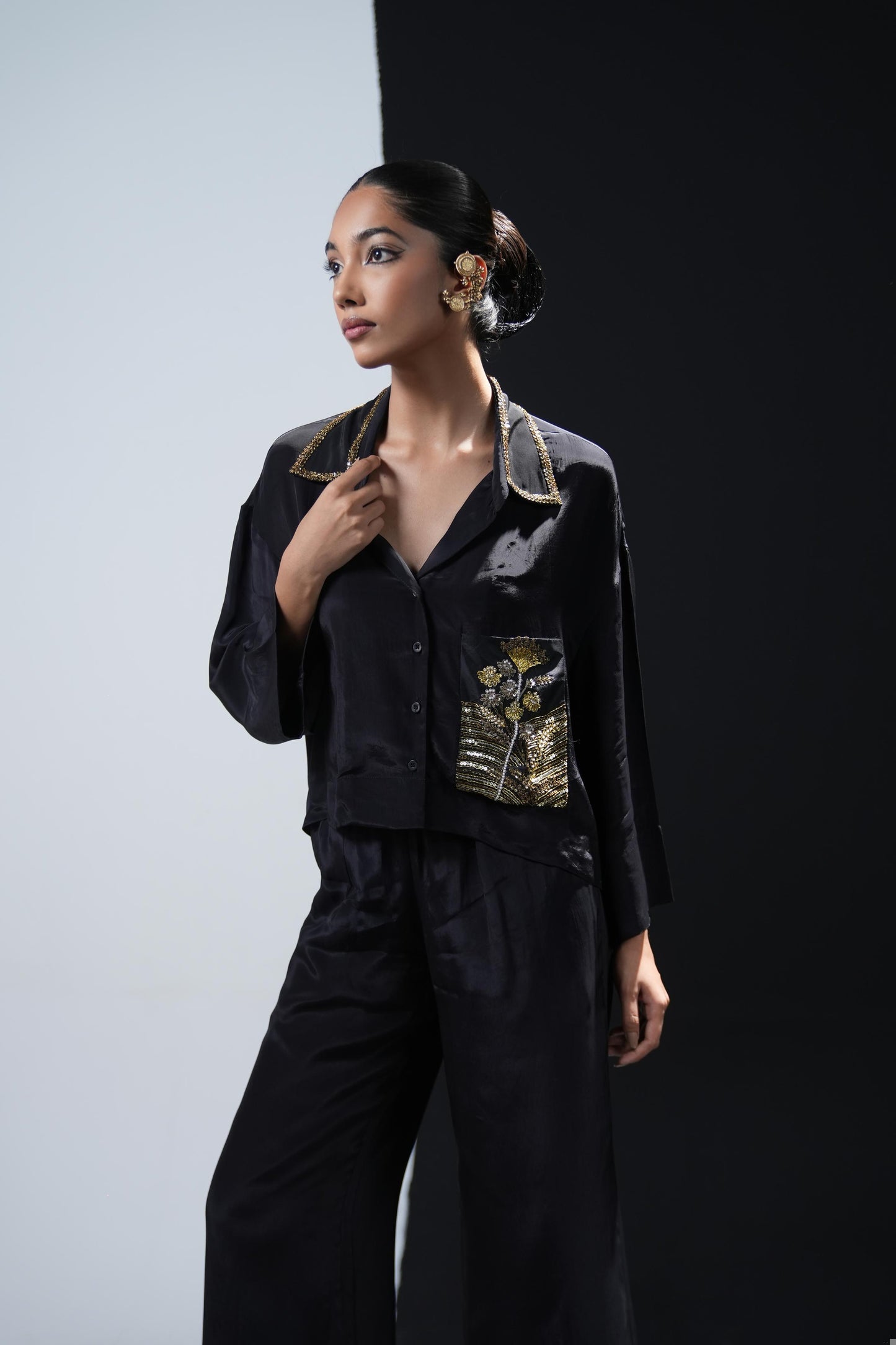 Crepe coord set with short flowing shirt and tonal gold zardosi detailing paired with black trousers