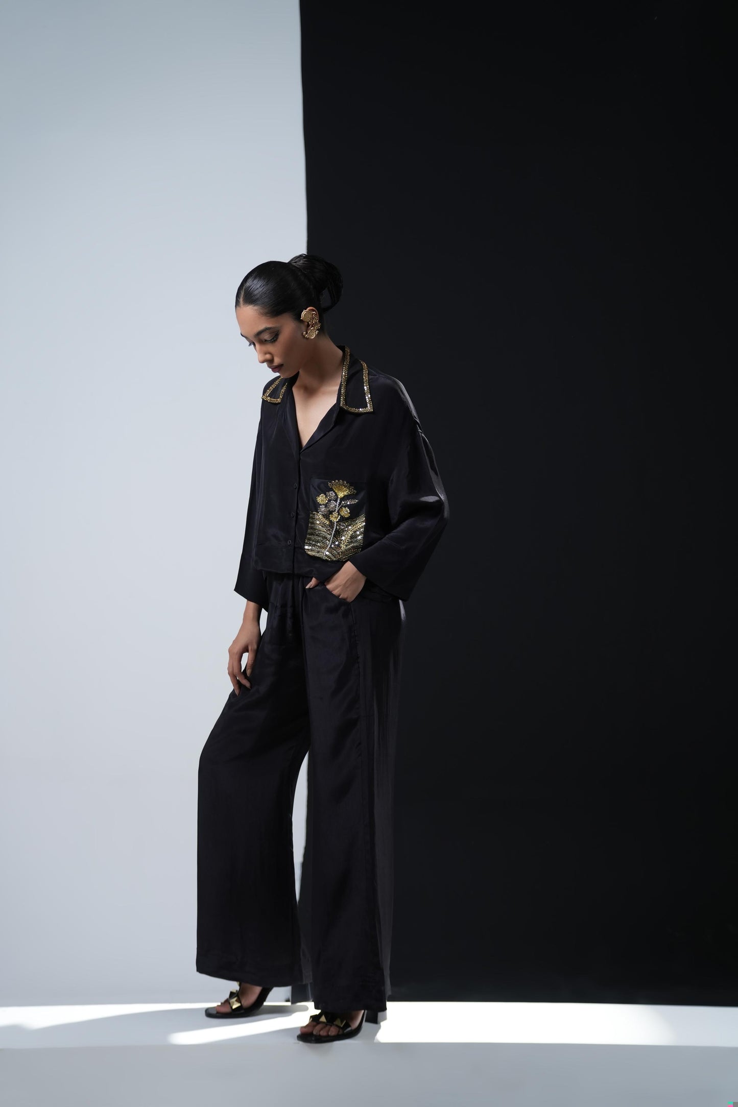 Crepe coord set with short flowing shirt and tonal gold zardosi detailing paired with black trousers