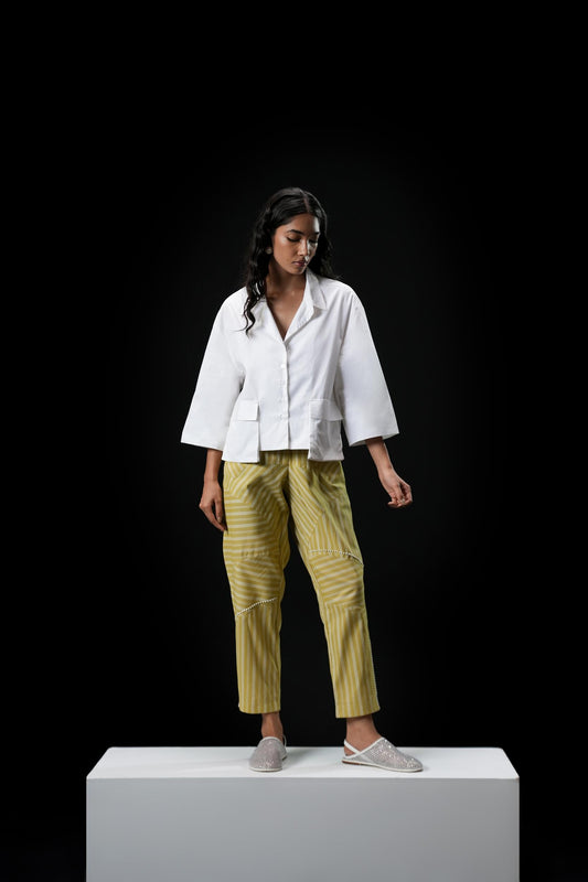 Cotton shirt with swarovski buttons paired with powder green trousers