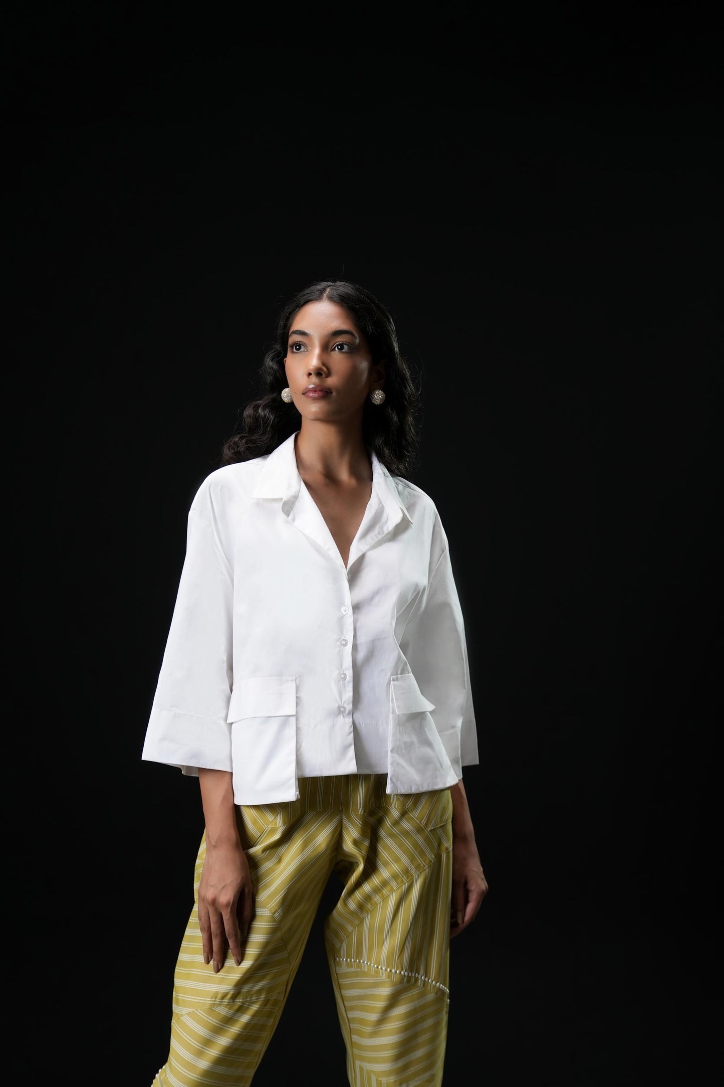 Cotton shirt with swarovski buttons paired with powder green trousers