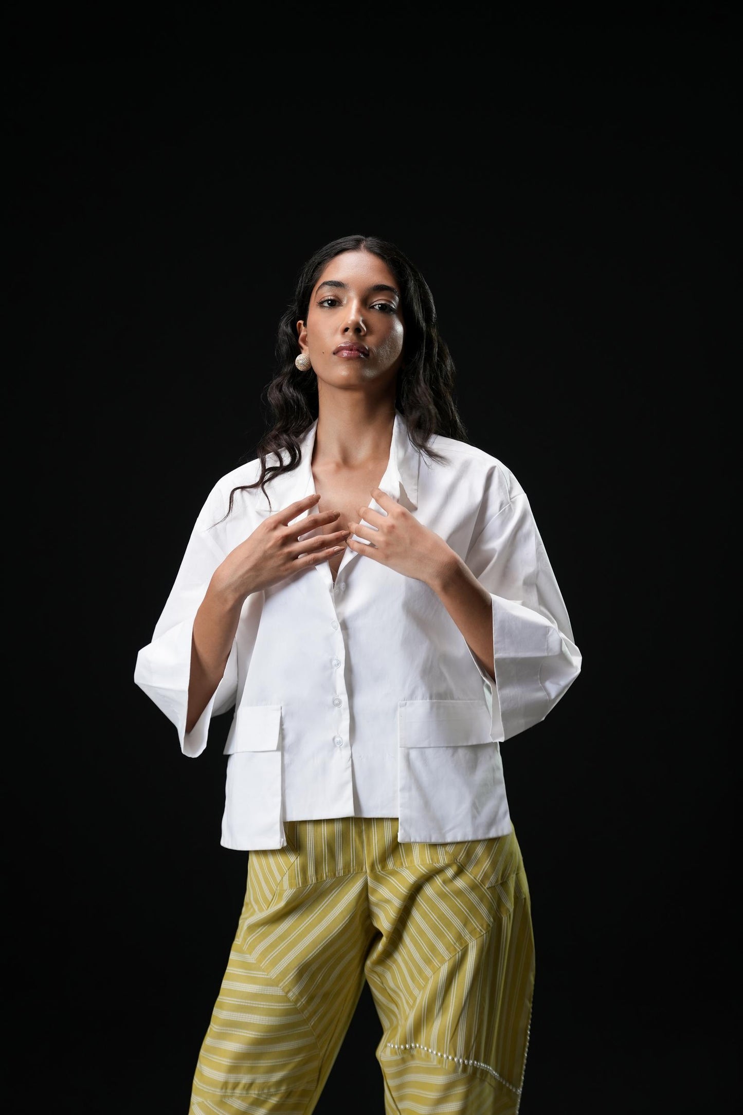 Cotton shirt with swarovski buttons paired with powder green trousers