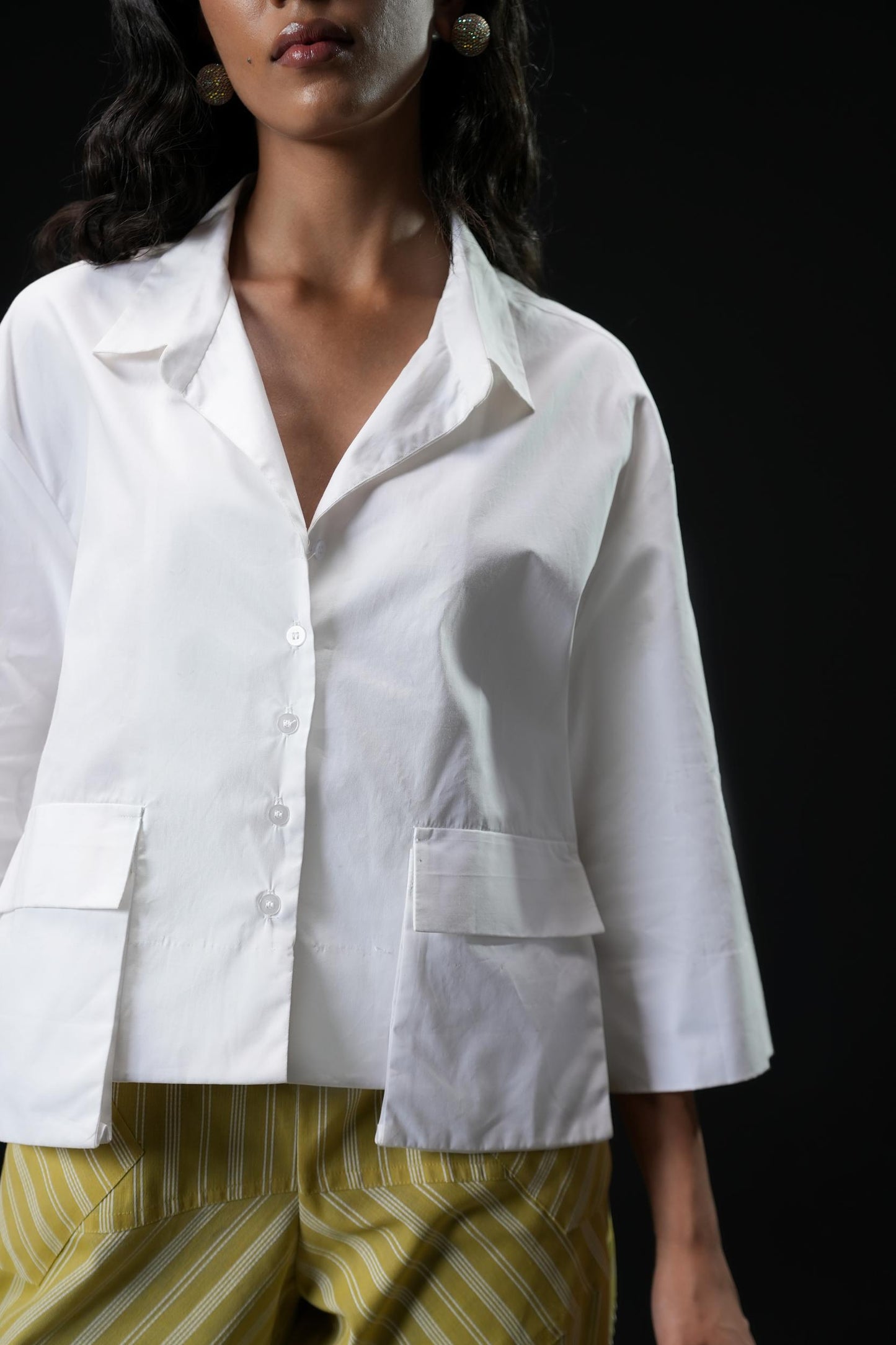 Cotton shirt with swarovski buttons paired with powder green trousers