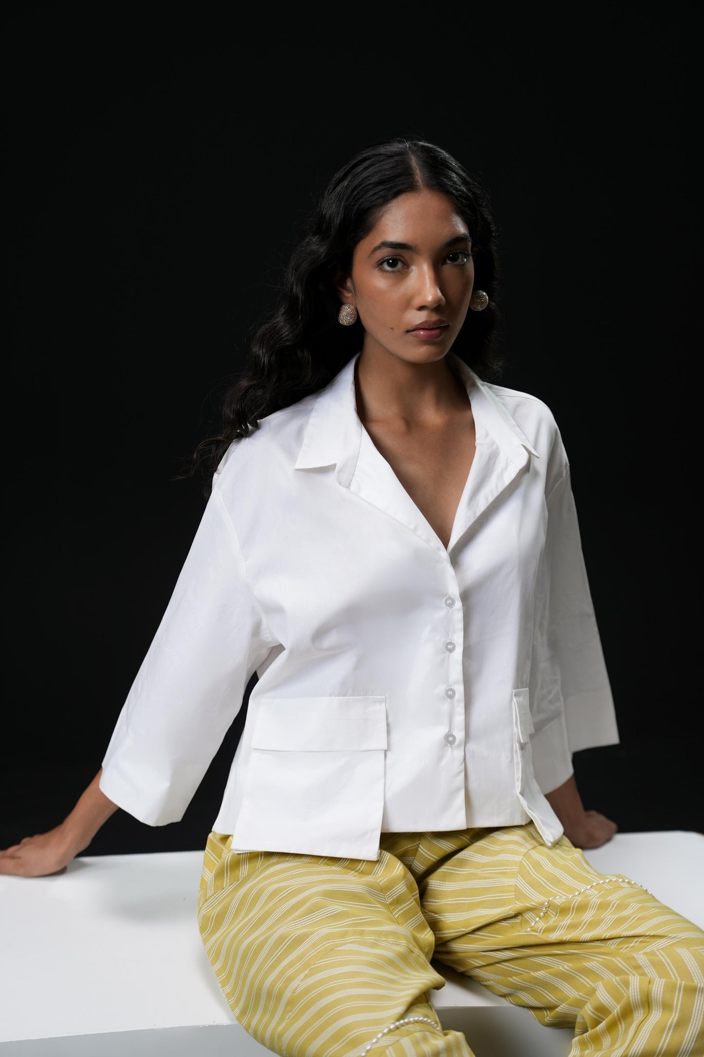 Cotton shirt with swarovski buttons paired with powder green trousers