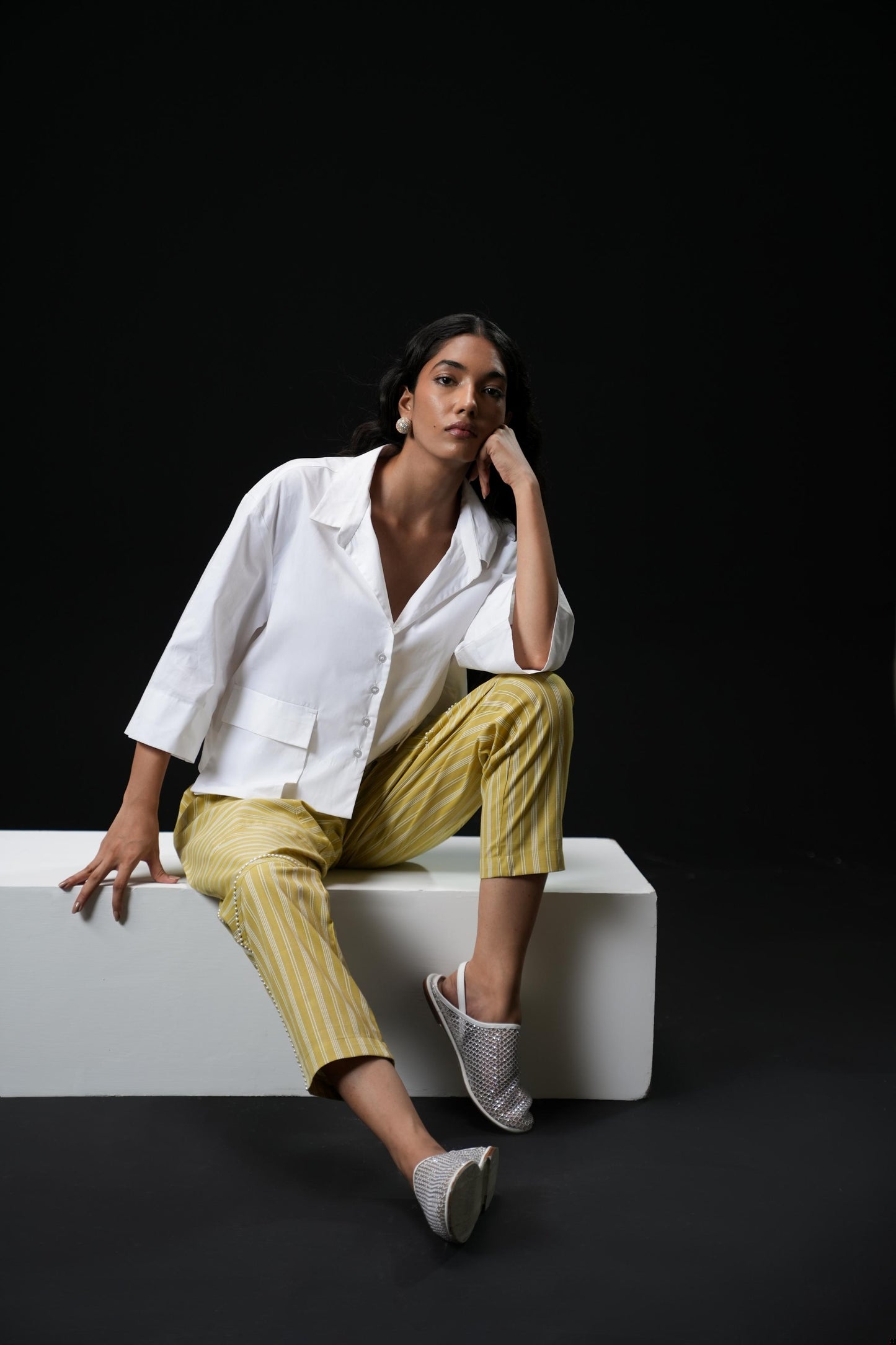 Cotton shirt with swarovski buttons paired with powder green trousers