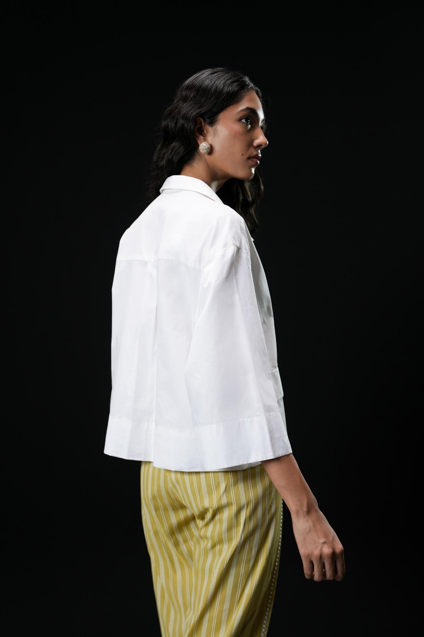 Cotton shirt with swarovski buttons paired with powder green trousers