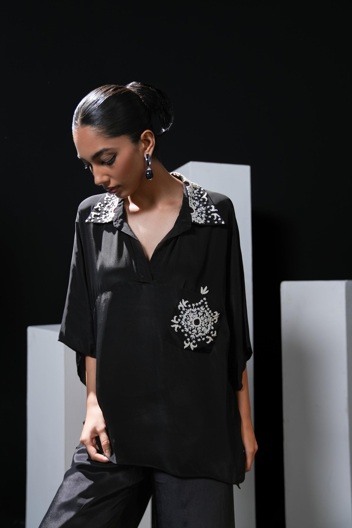 Crepe black coord set with pearl detailing on the pocket, collars and trousers
