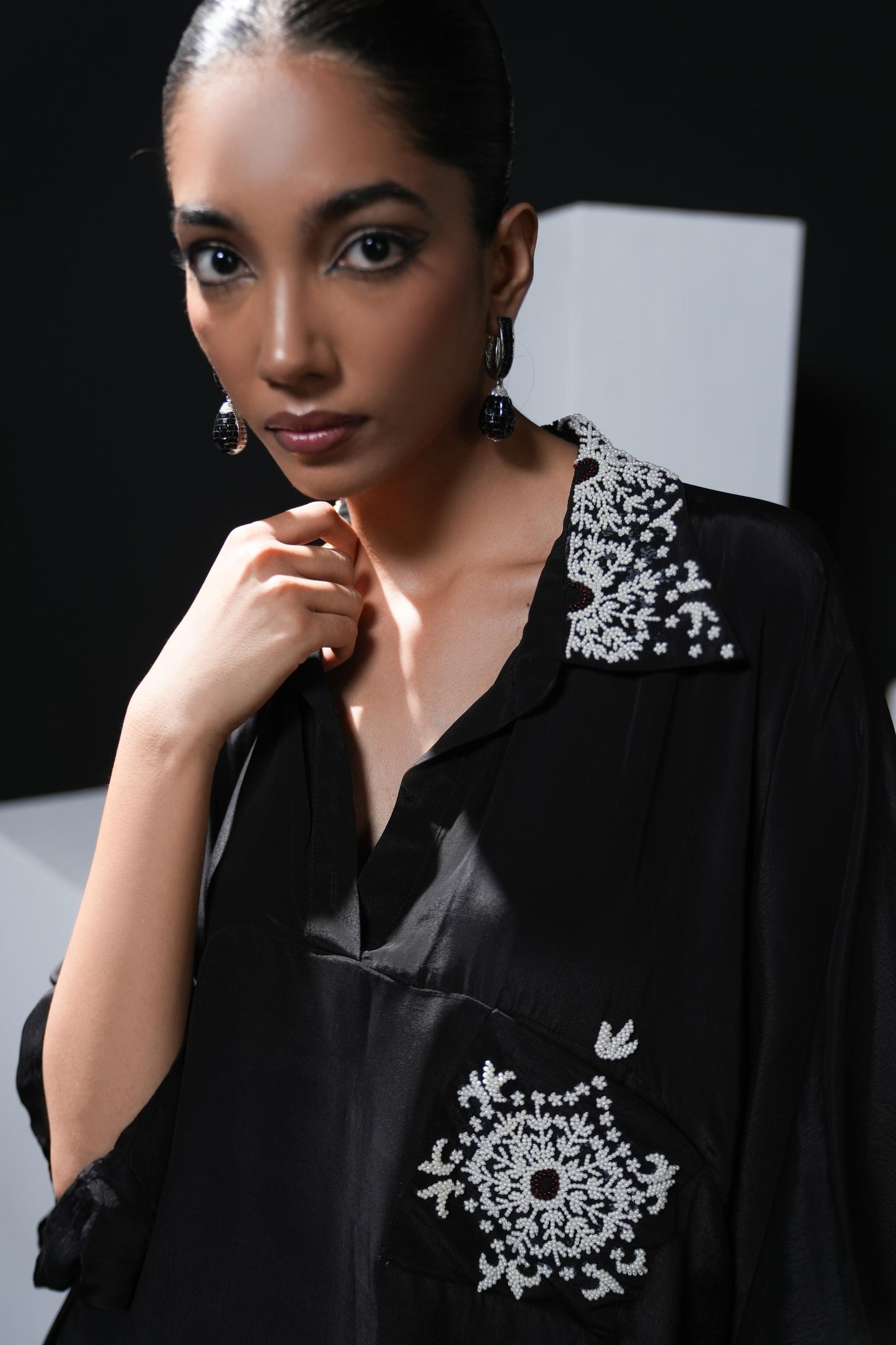 Crepe black coord set with pearl detailing on the pocket, collars and trousers