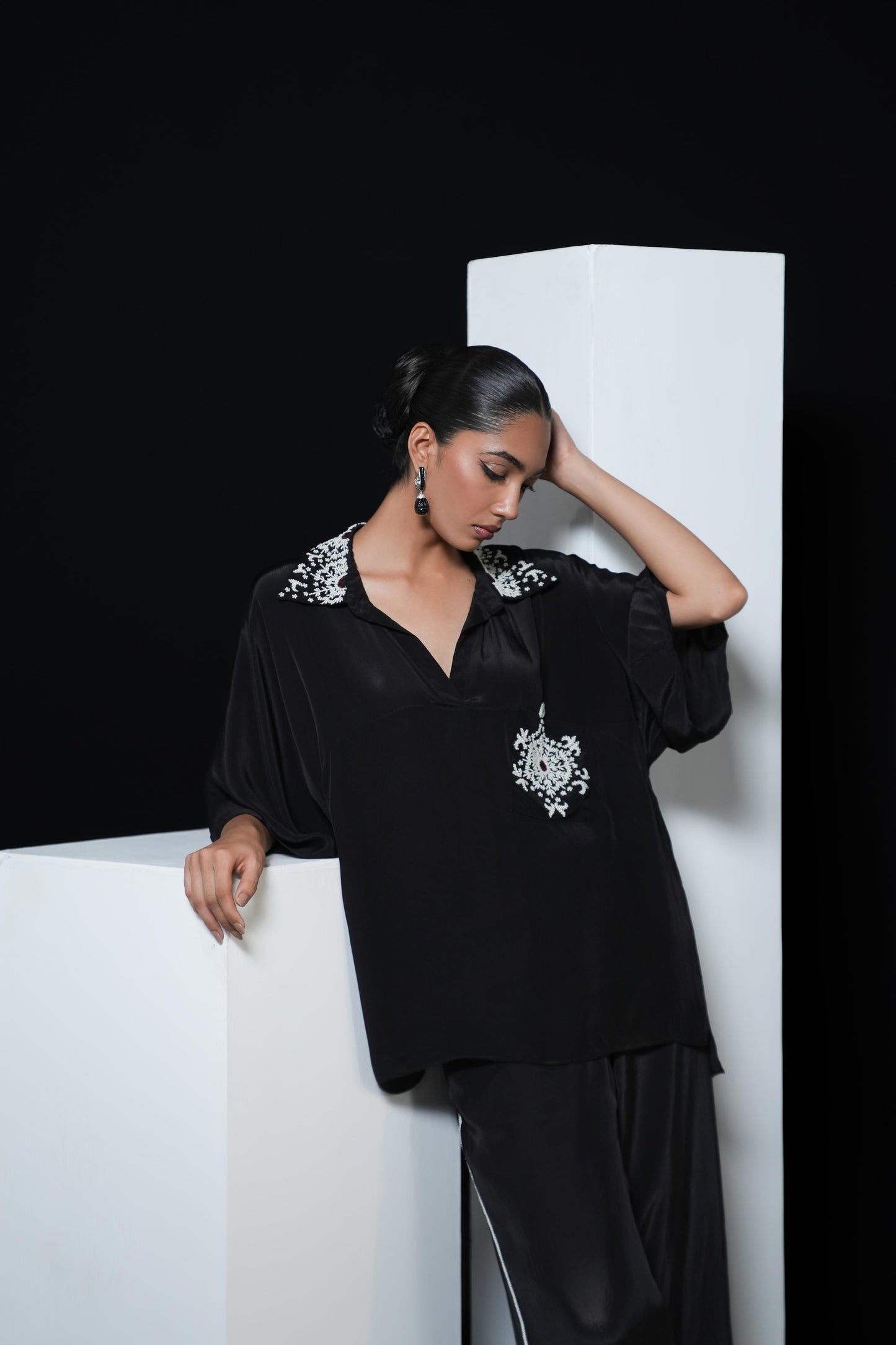 Crepe black coord set with pearl detailing on the pocket, collars and trousers