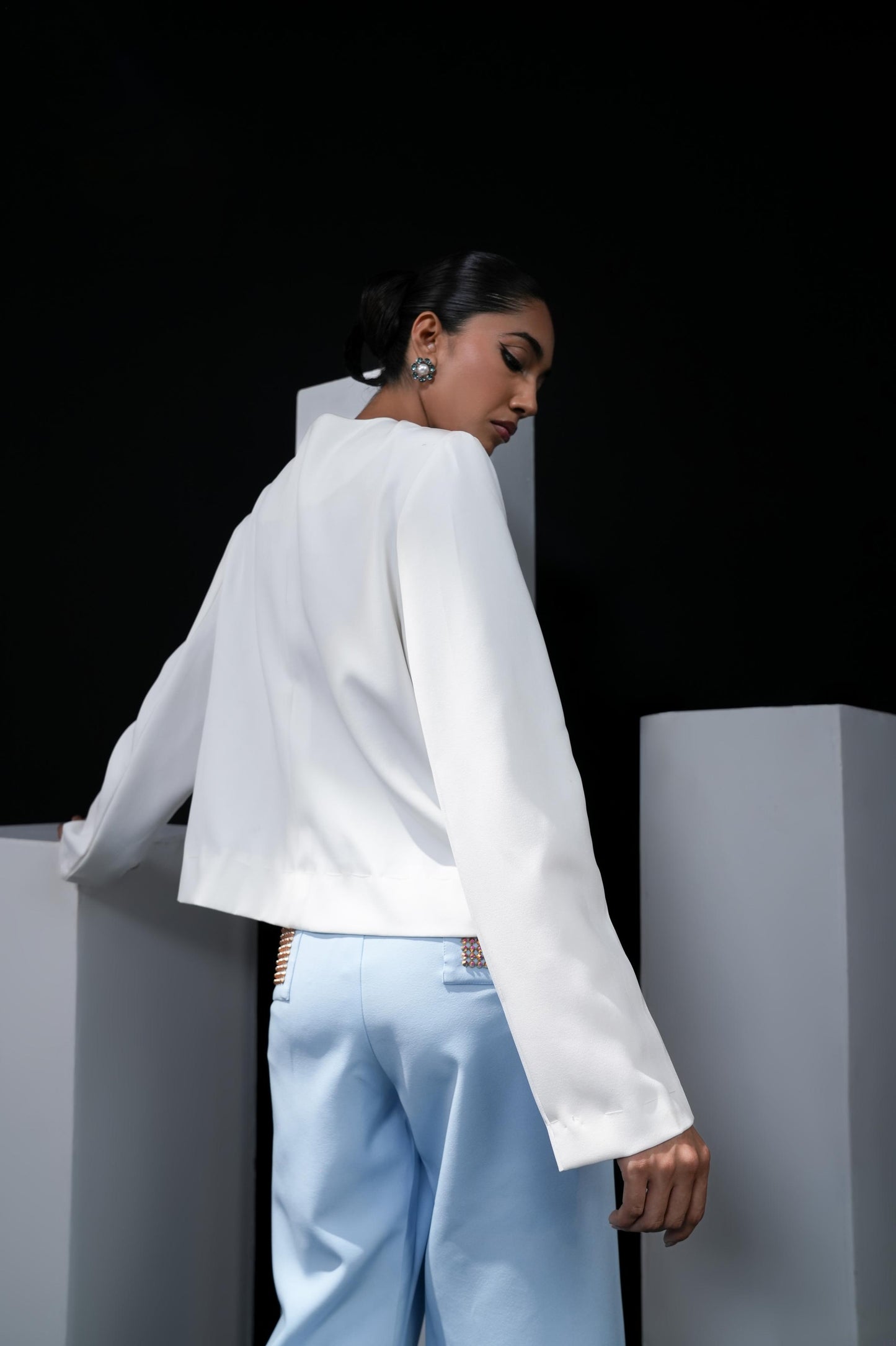 Sky blue trousers with swaroski detailing on the pockets