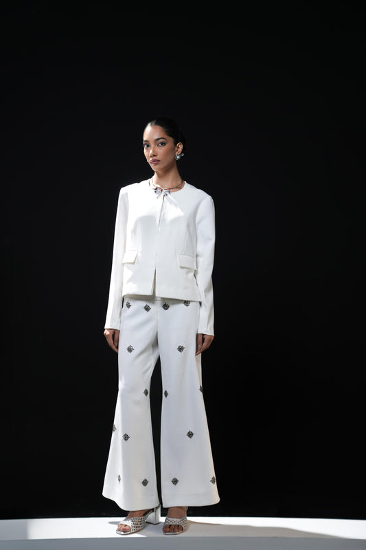 White bootcut trousers with swaroski embelishments