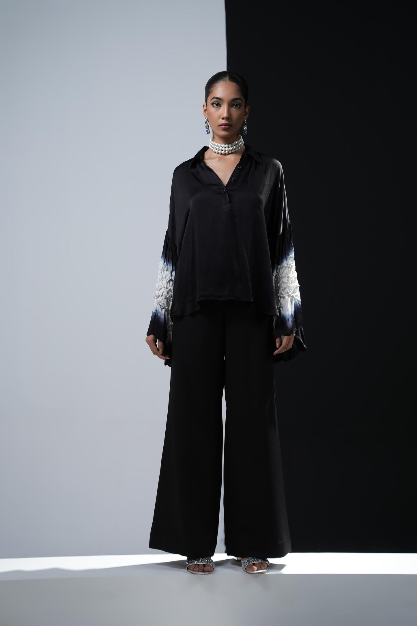 Black satin shirt with white shibori work on the sleeves