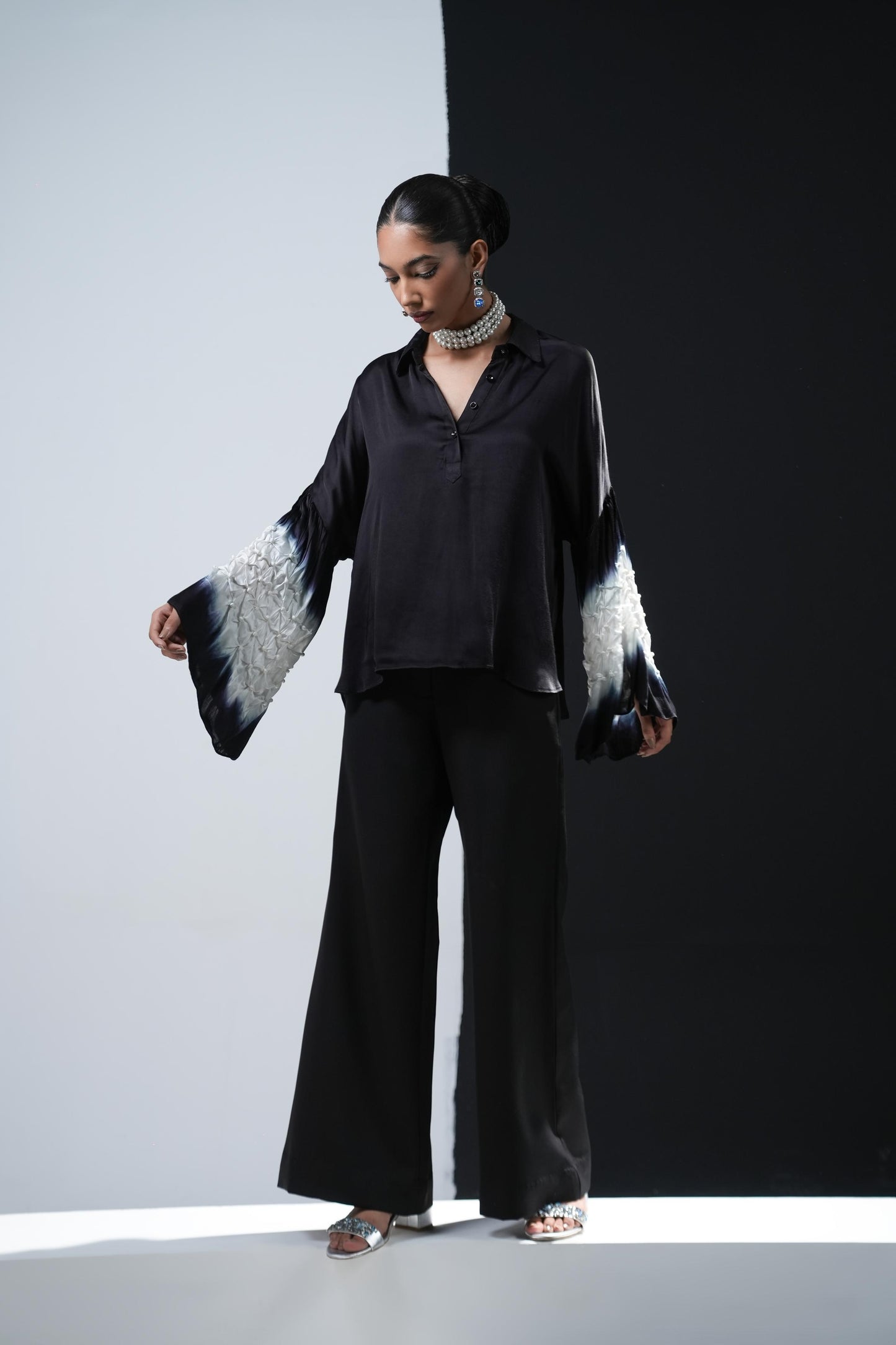 Black satin shirt with white shibori work on the sleeves