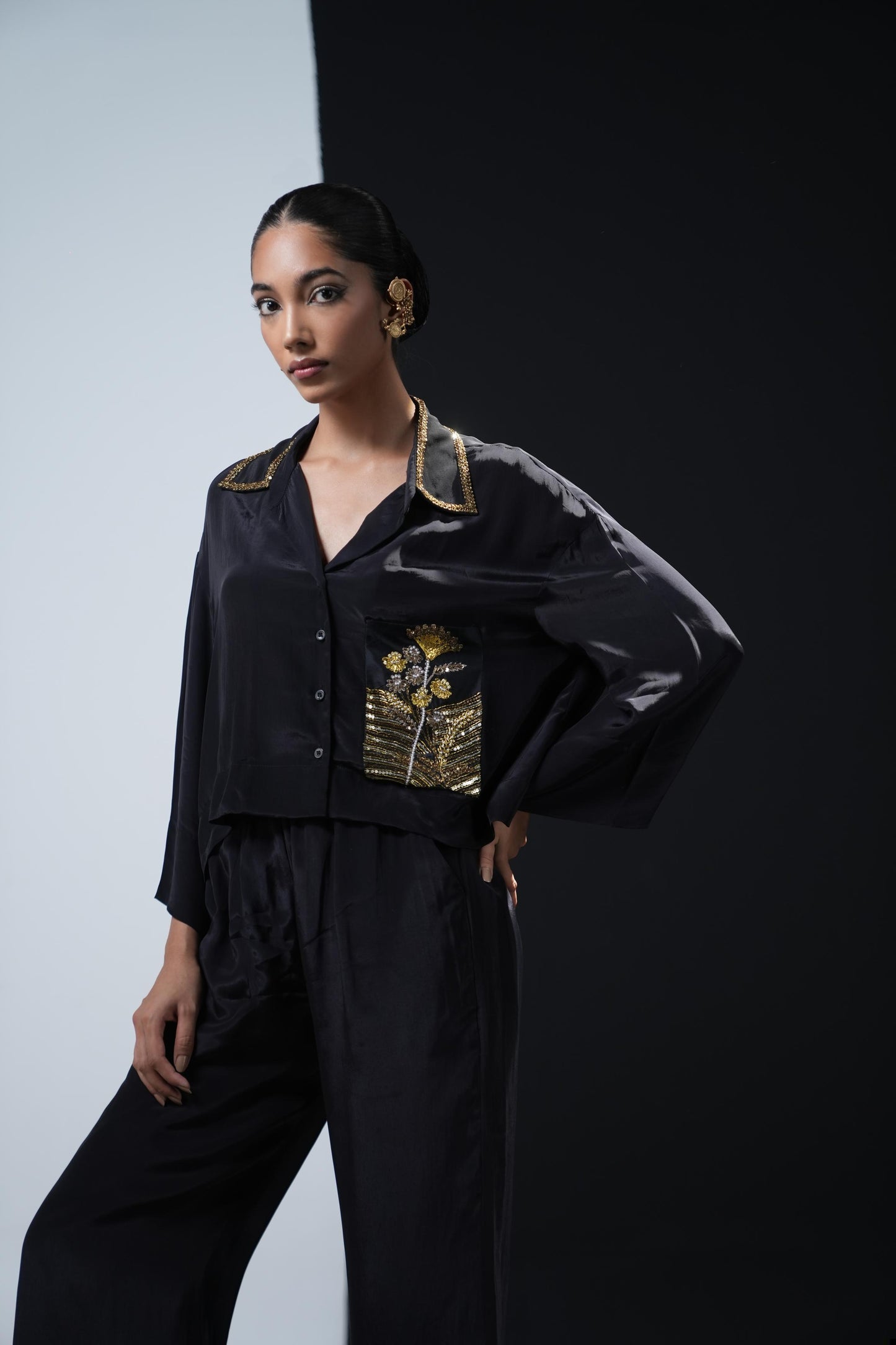 Crepe coord set with short flowing shirt and tonal gold zardosi detailing paired with black trousers